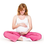 Close-up of a pregnant woman's sitting