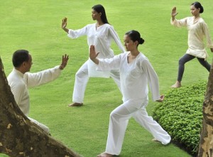 28 May 2009, Unknown --- A group of people doing Tai Chi outdoors --- Image by © Luca Tettoni/Robert Harding World Imagery/Corbis